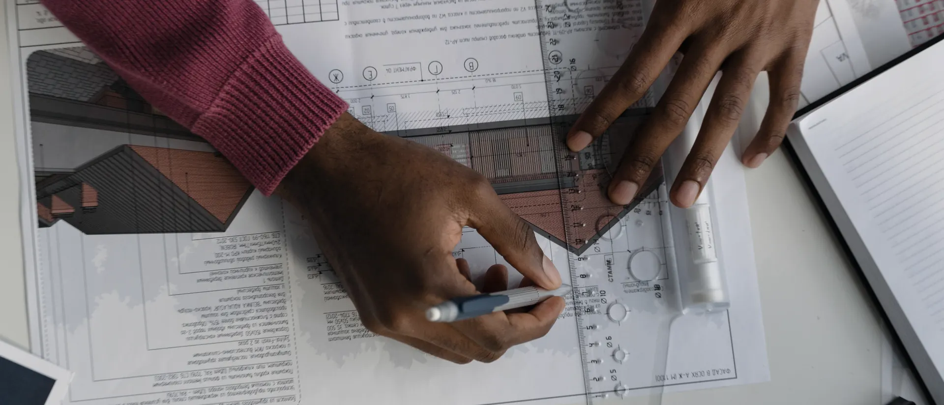 Architect working on blueprints