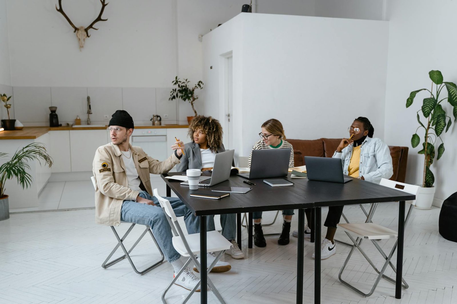 A diverse group of professionals collaborating in a modern and stylish office setting.