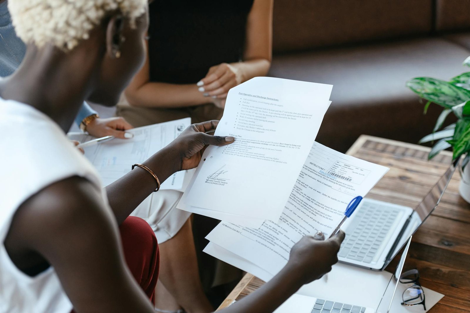 Business professionals comparing Zoho People and Keka HRMS features side by side