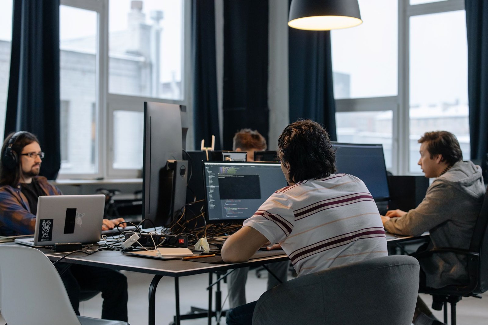 Business team reviewing SaaS software costs on a laptop.