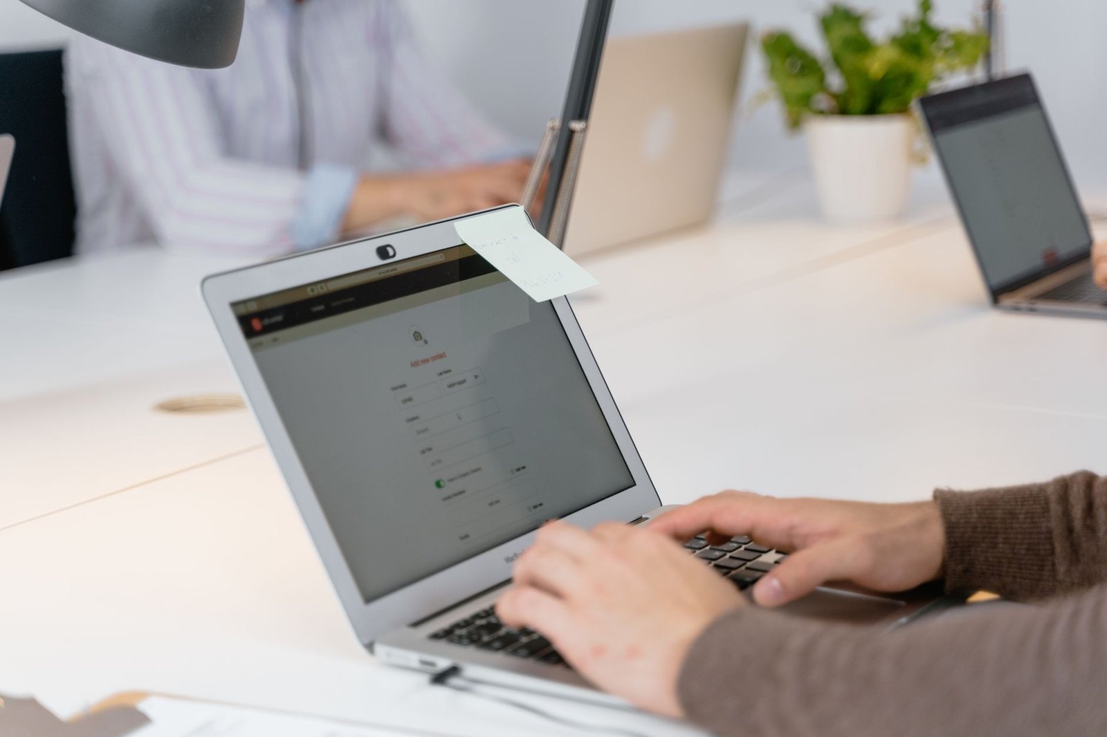 Job board listing displayed on a laptop screen in a modern office
