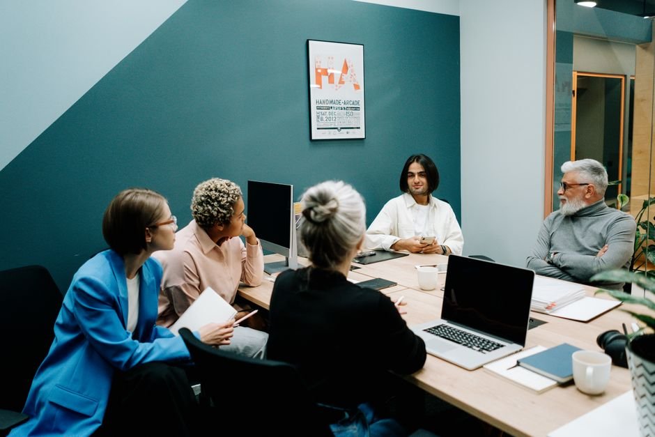 staffing team discussing ATS software options